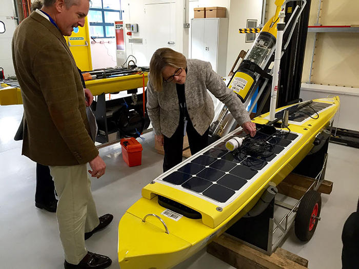 Dr Sullivan inspects an Autonomous Surface Vechicle at NOC’s Marine Robotics Innovation Centre