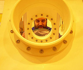 Engineer Robin Brown building the extended isolation tent