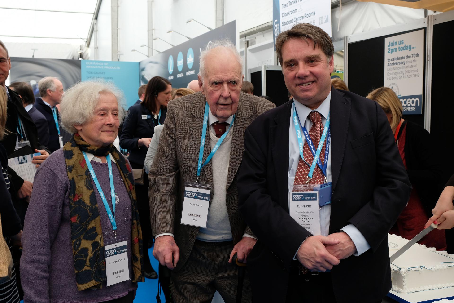 Cutting the celebration cake with Ed Hill, the present Director of the NOC, were Dr Jim Crease, former head of Marine Physics at IOS who joined NIO on its formation in 1949, and Dr Margaret Seward, daughter of Sir George Deacon and a notable historian of Oceanography.