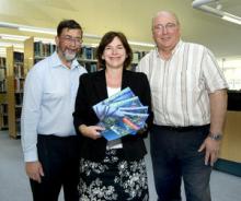 Jane Stephenson of NOL with Trevor Guymer (left) and Rolly Rogers (right)