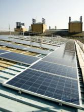 The NOC PV array during installation (the gaps between the panels allow the continued use of sky lights in the area)