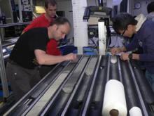 The picture shows Pete Talling from NOC logging a section of hemipelagic sediment (pale layers), volcanic turbidites