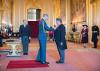 Professor Ed Hill receiving CBE insignia from HRH The Duke of Cambridge and Windsor Castle. 