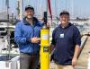 James Ketchell and Dr Ben Moat with an Argo float in Gosport marine.